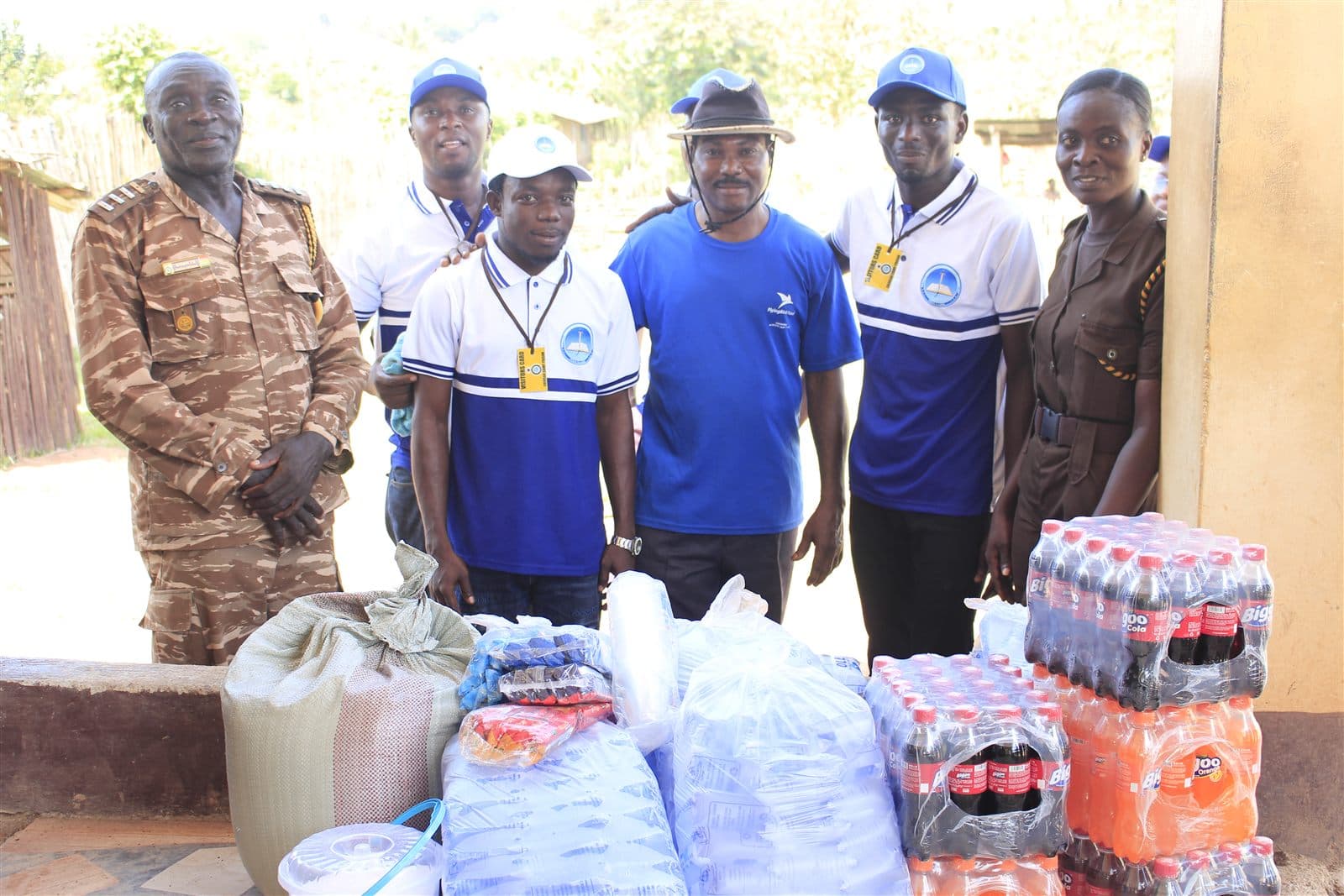 Bethel Inspiration team members with prison officers behind the donated drinks, water and provisions at Ahinsan Prison